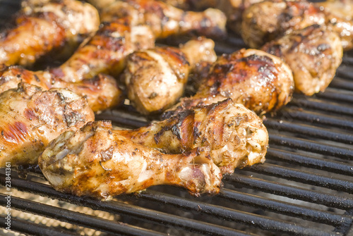 Jerk Chicken Drumsticks Cooking on the Barbecue Grill