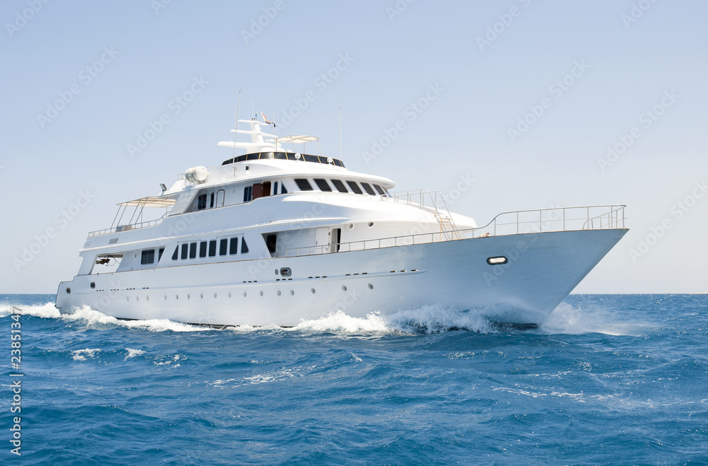 Large motor yacht under way at sea - obrazy, fototapety, plakaty 