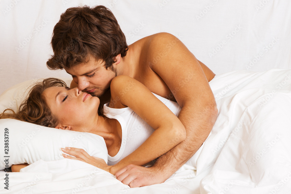 Young beautiful couple in bed Young beautiful couple in bed
