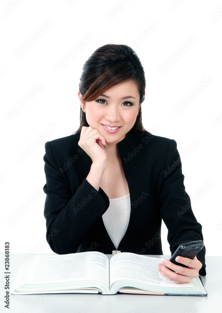 Happy young businesswoman holding mobile phone Happy young businesswoman holding mobile phone