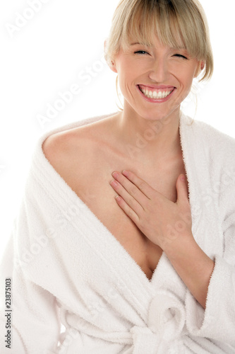 Woman applying cream on chest
