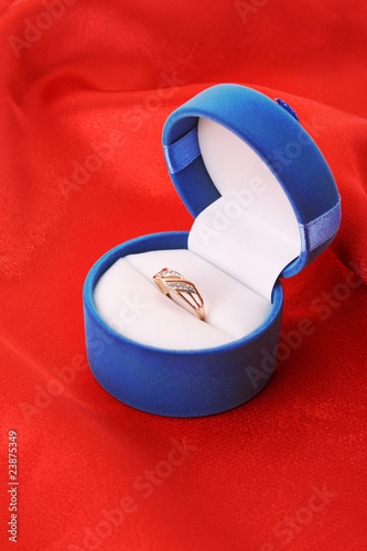 Golden ring on red background