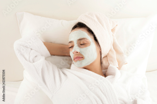 Woman with facial mask resting