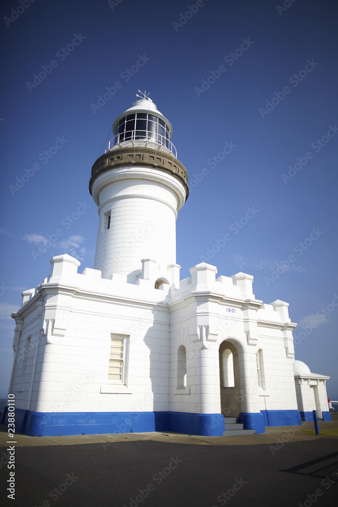 Lighthouse whitewashed with blue skies