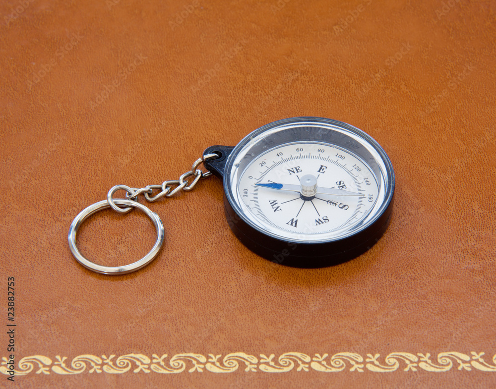 Old compass on leather desk Old compass on leather desk