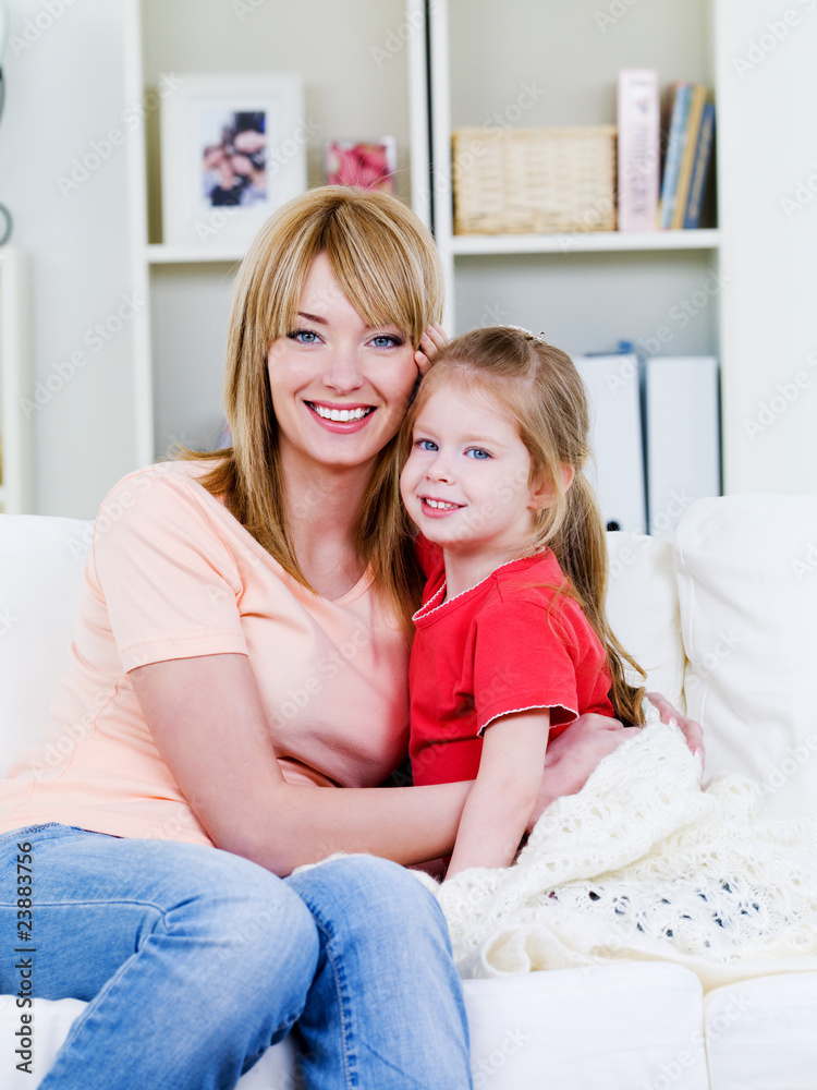 Woman embracing her daughter Woman embracing her daughter