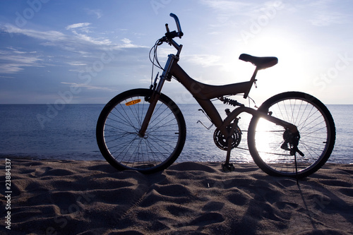 Fototapeta Naklejka Na Ścianę i Meble -  Silhouette of a Bike on the Beach