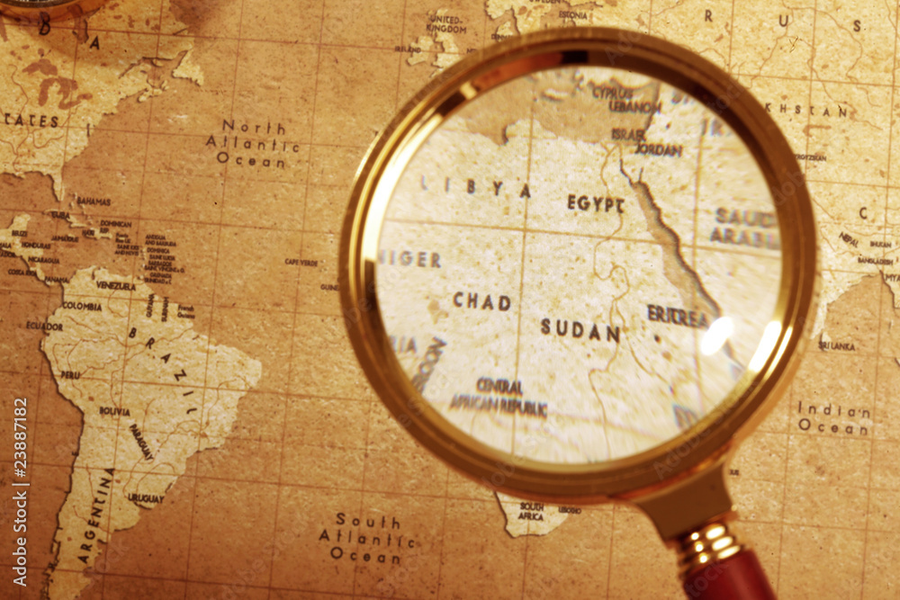 An Magnifier on a Treasure map background An Magnifier on a Treasure map background