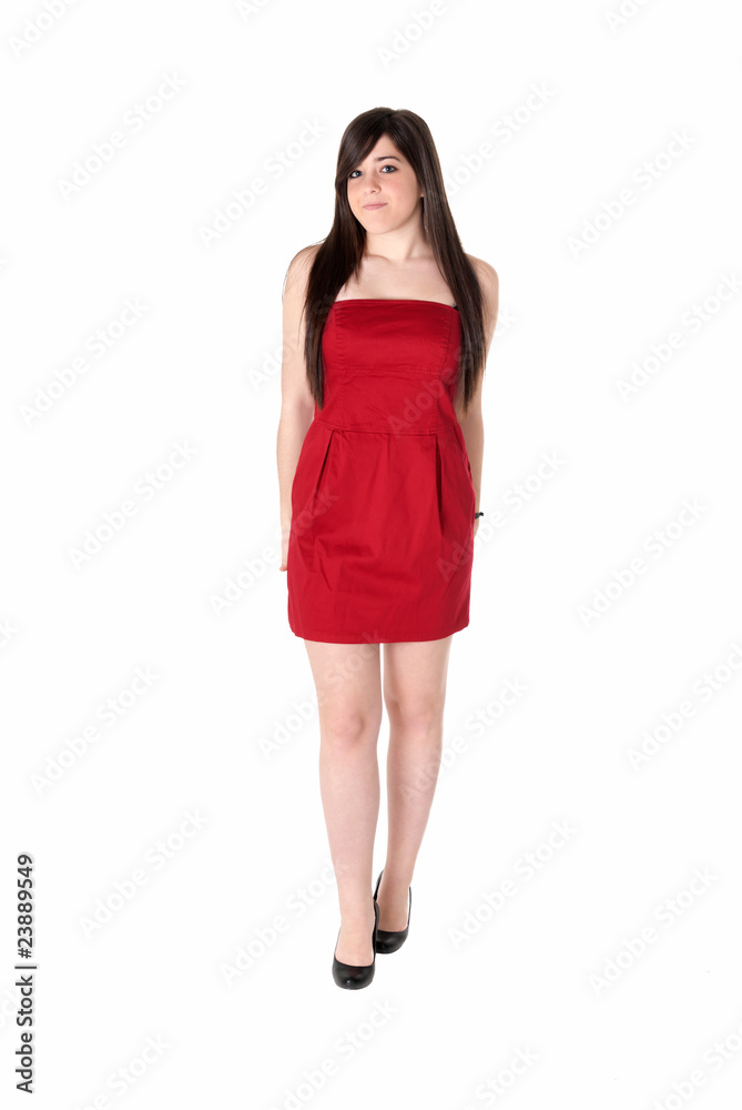 Young beautiful girl with red dress standing isolated on white Young beautiful girl with red dress standing isolated on white