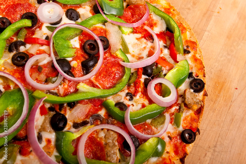 Pizza with vegetables and pepperoni