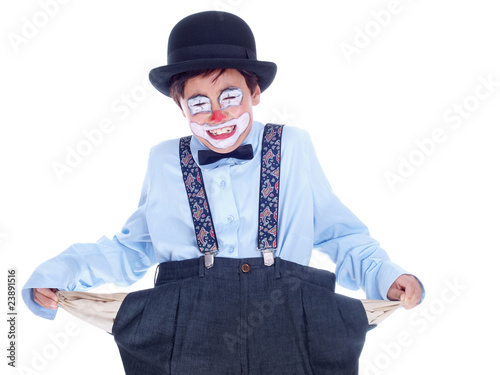 crying child clown showing his empty trousers pockets