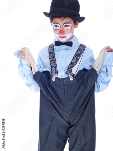 sad child clown showing his empty trousers pockets