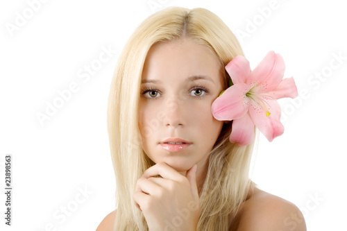 Beautiful blond woman with pink lily isolated on white