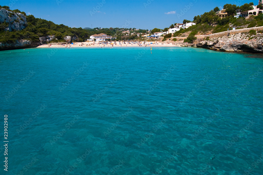 Turquoise water and the beach of Cala Romantica, Majorca, Spain