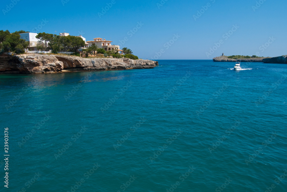 Speed boat entering Porto Cristo bay, Majorca, Spain