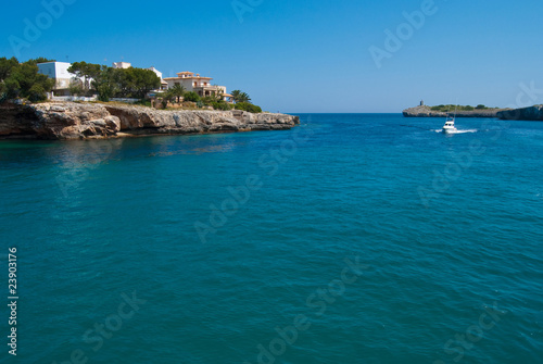 Speed boat entering Porto Cristo bay, Majorca, Spain