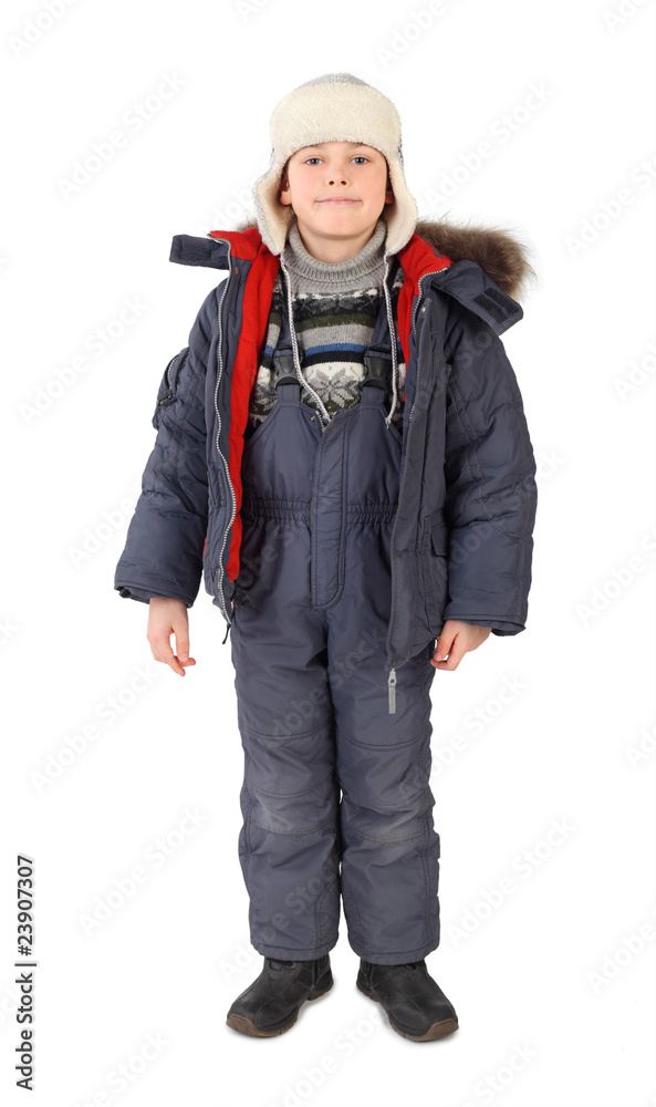 little boy in winter dress standing and smiling isolated little boy in winter dress standing and smiling isolated