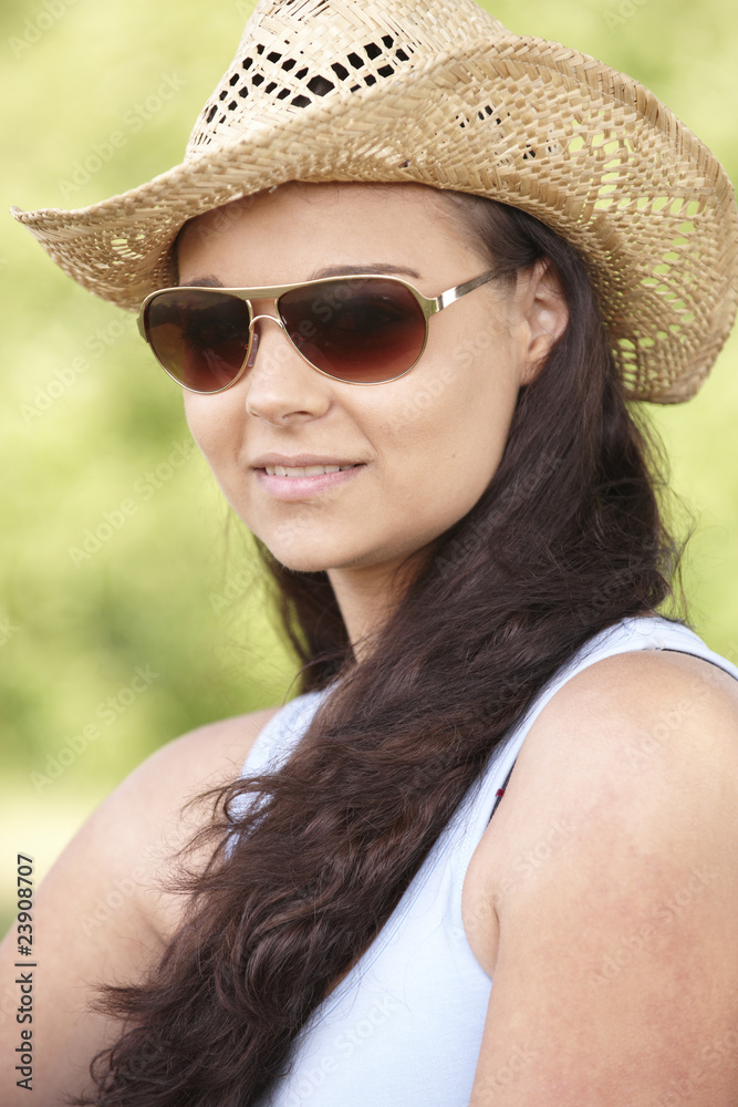 girl wearing hat and sunglasses