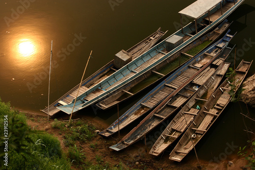 Fototapeta Traditional boats in the river Luang Prabang Laos