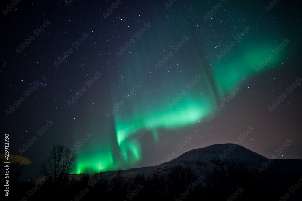 Aurora Borealis curtains rippling in the sky