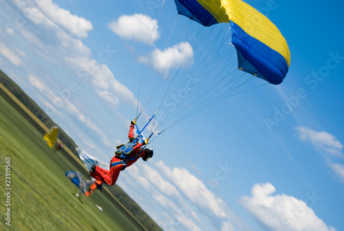 Landing of the sportsman after parachute jump