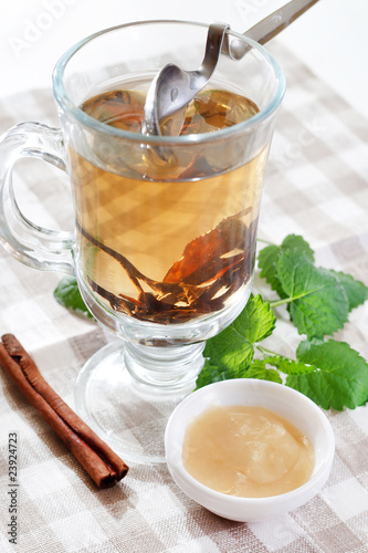 Cup of tea with honey and herbs