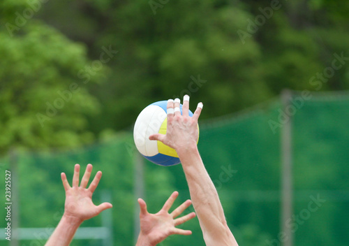 beach volleyball spike photo