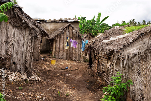 Dusty street of poor african village photo