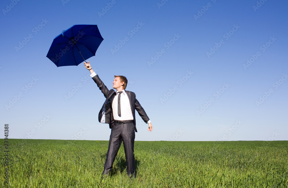 Portrait of businessman under umbrella on the background of sky Portrait of businessman under umbrella on the background of sky