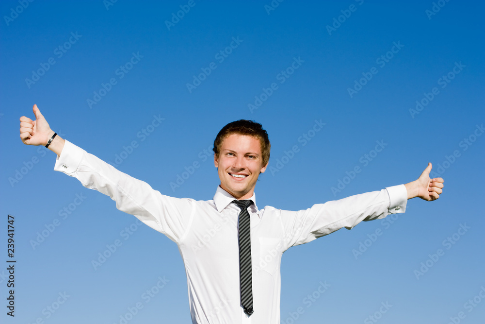 Portrait of happy businessman lifting up hands on the background Portrait of happy businessman lifting up hands on the background