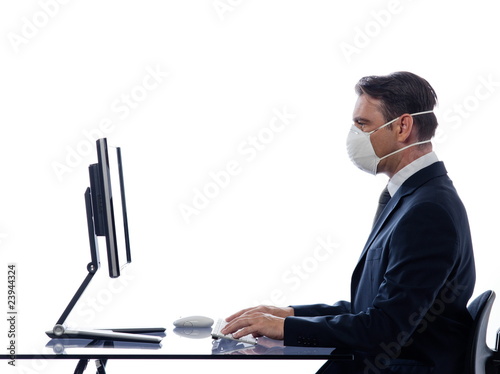 man cumputing computer wearing protection mask concept