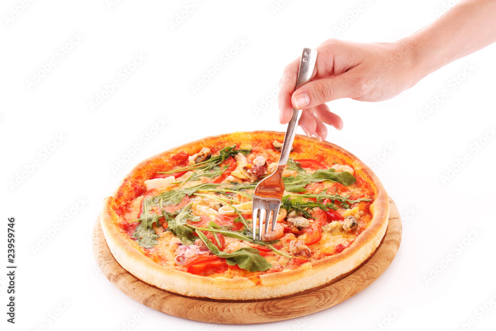 Someone slicing pizza isolated on white