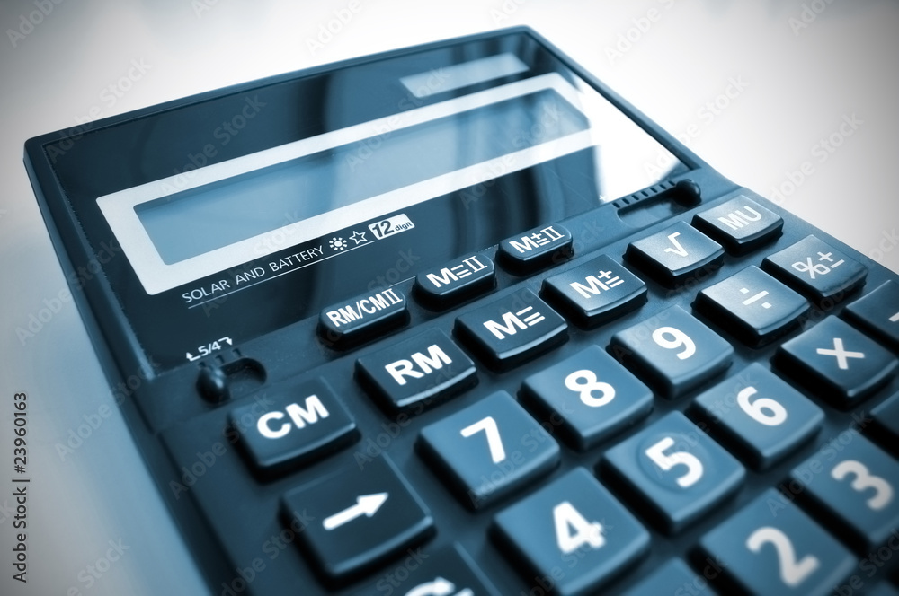 Office desk calculator with reflection of daylight. Office desk calculator with reflection of daylight.