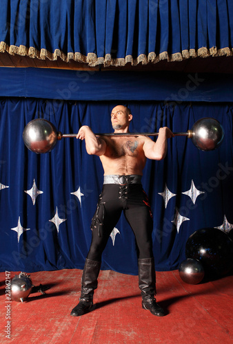 Portrait of one-eyed circus athlete. photo