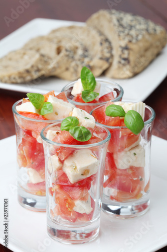 Caprese appetizers with tomatoes, mozzarella and basil