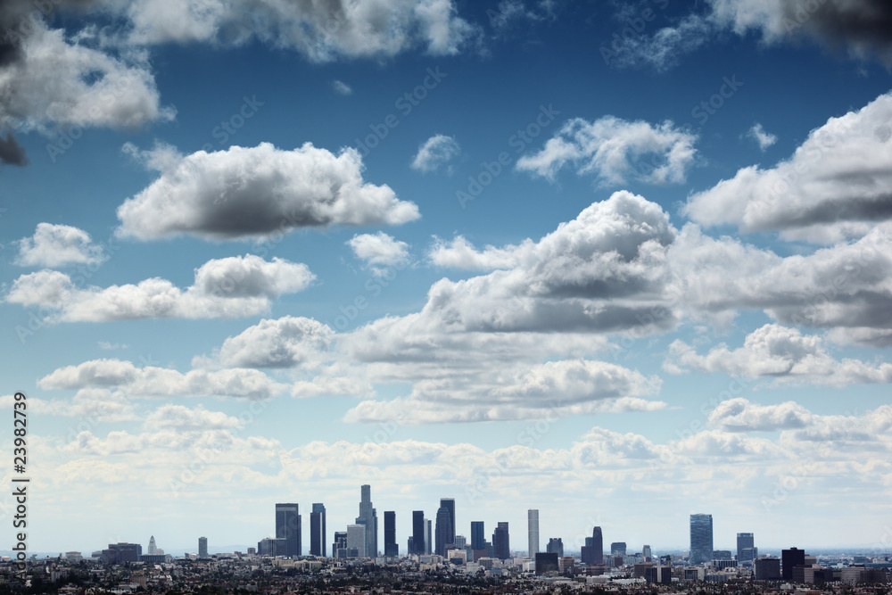 Fototapeta premium Downtown Los Angeles skyline under blue sky with scenic clouds