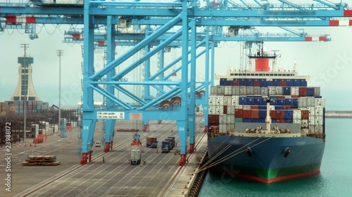 Loading of cargoes on the cargo ship. Time lapse