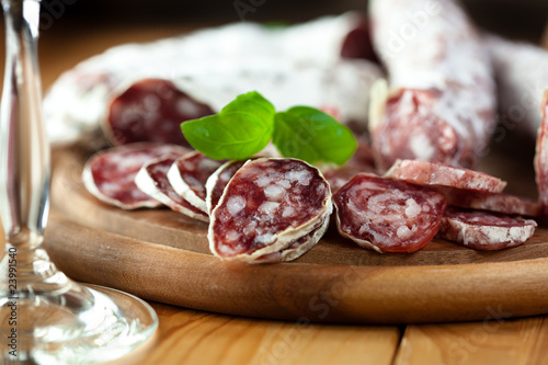 French dried sausage on rustic wooden table