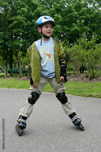 Preschooler learning to ride on rollerblades