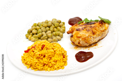chicken with mexican style rice and  green peas, isolated