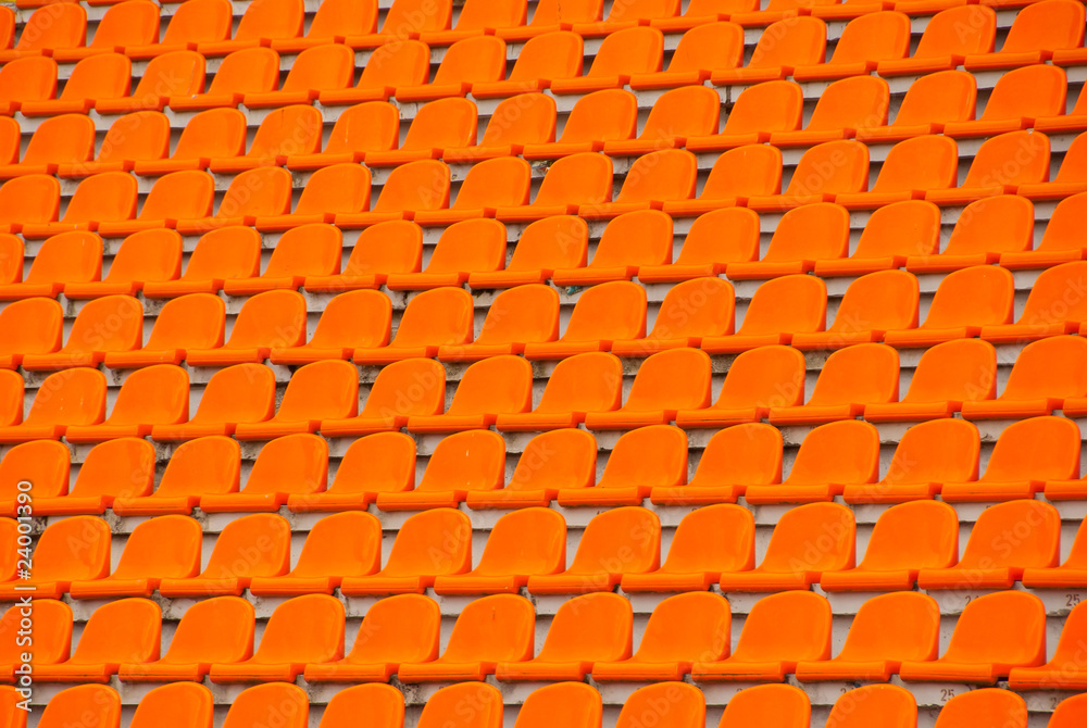 Fototapeta premium Orange empty stadium seats