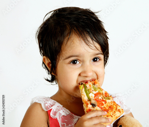 toddler eating pizza slice