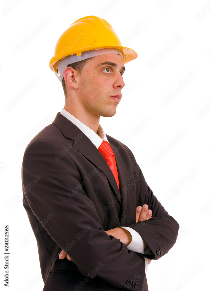 Pensive young engineer with a yellow helmet on white background Pensive young engineer with a yellow helmet on white background