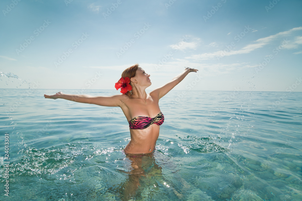 Sexy red girl wearing bikini enjoying water Sexy red girl wearing bikini enjoying water