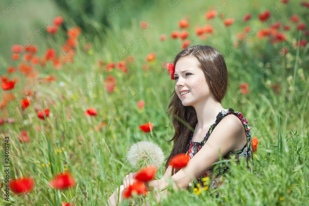 The beautiful girl on the nature in a grass and flowers. The beautiful girl on the nature in a grass and flowers.