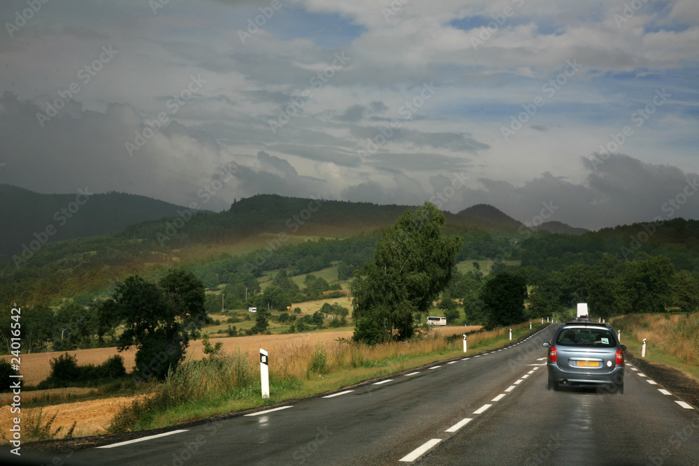 Rainbow on the road in the French Pyrenees Rainbow on the road in the French Pyrenees