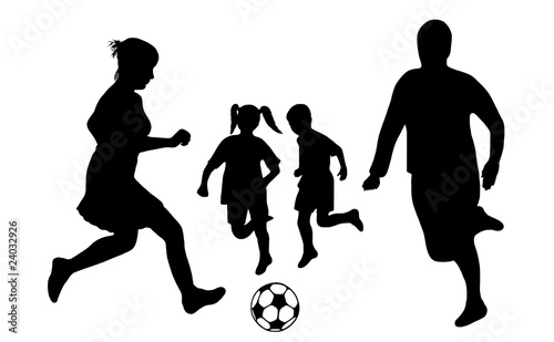silhouette of a family playing soccer