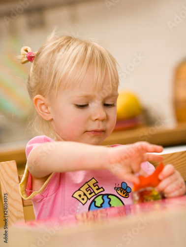 little girl eating candy