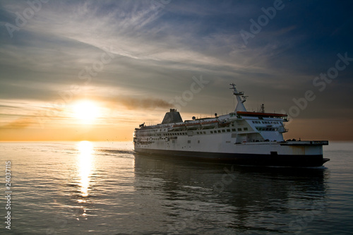 Ferry boat on the sunset in the sea © mcsdwarken