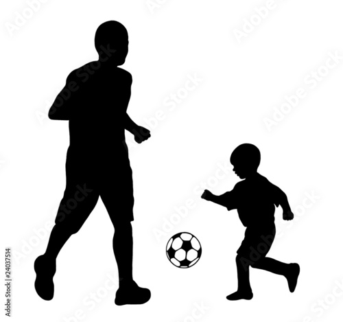 father and son playing soccer